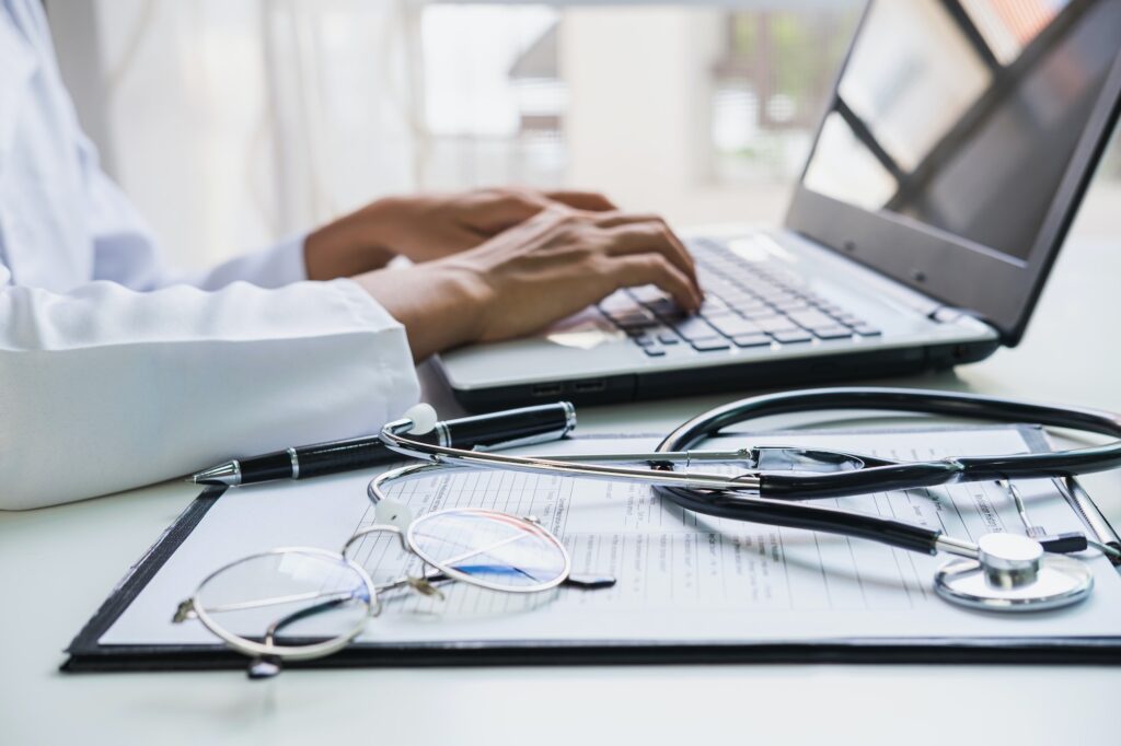 Doctor using a laptop in the hospital, Healthcare and Medicine concept