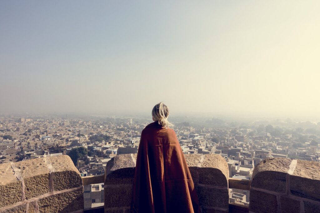 western woman exploring jaisalmer fort, rajasthan, india