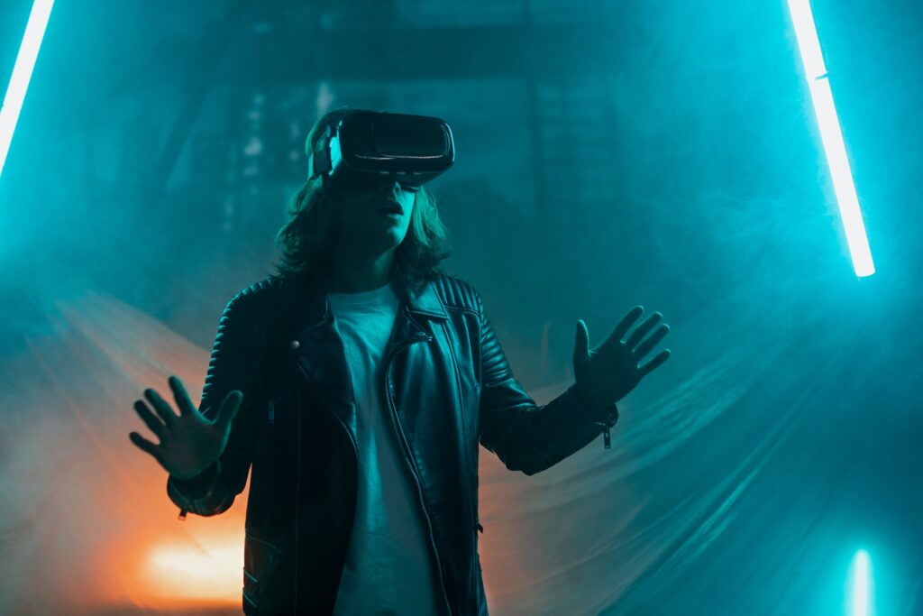 Metaverse digital cyber world technology, man with virtual reality VR goggles playing augmented