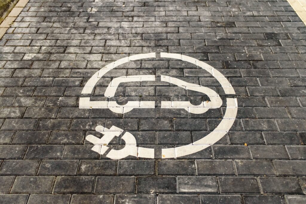 Refill station signal for electric vehicles painted on the ground.