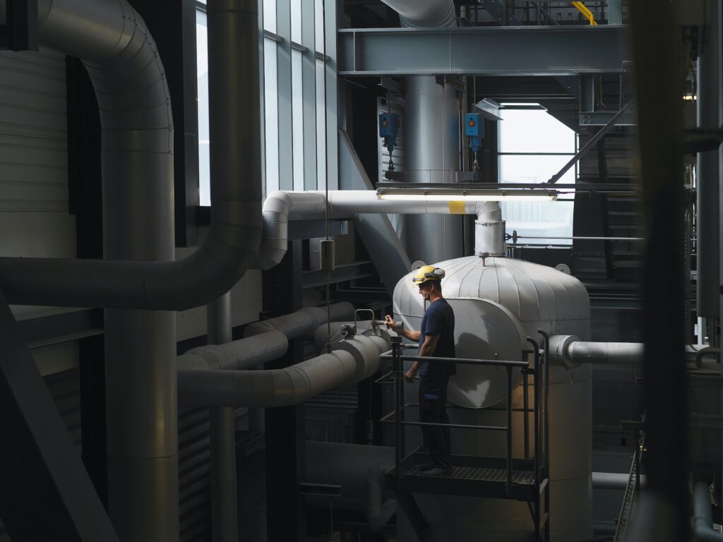 Worker operating machinery in factory