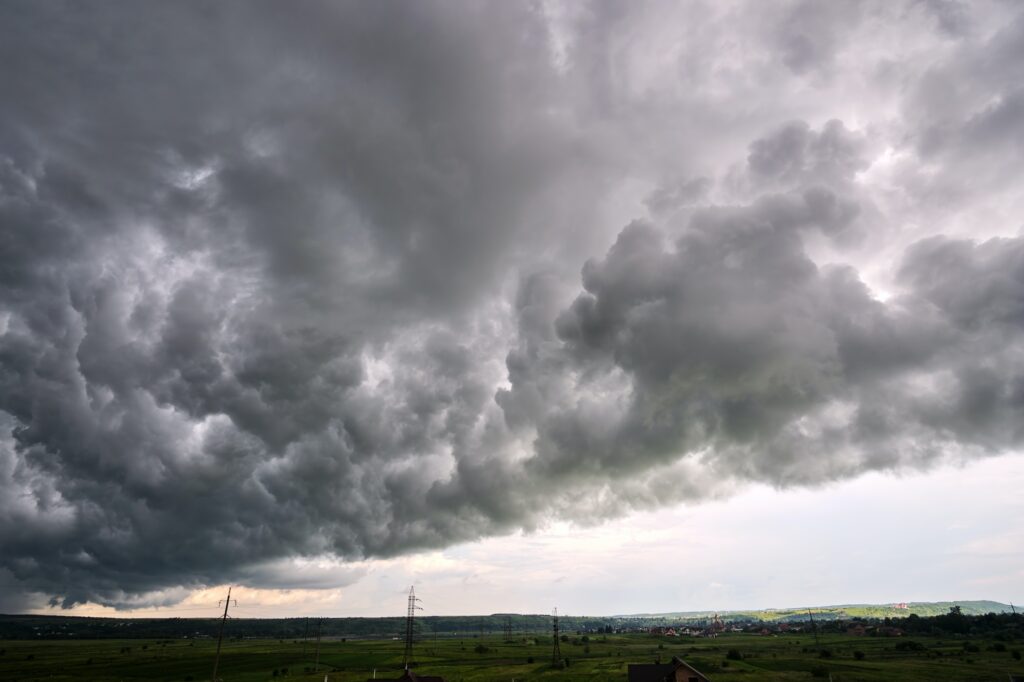 Landscape of dark ominous clouds like volcano eruption on stormy sky during heavy thunderstorm