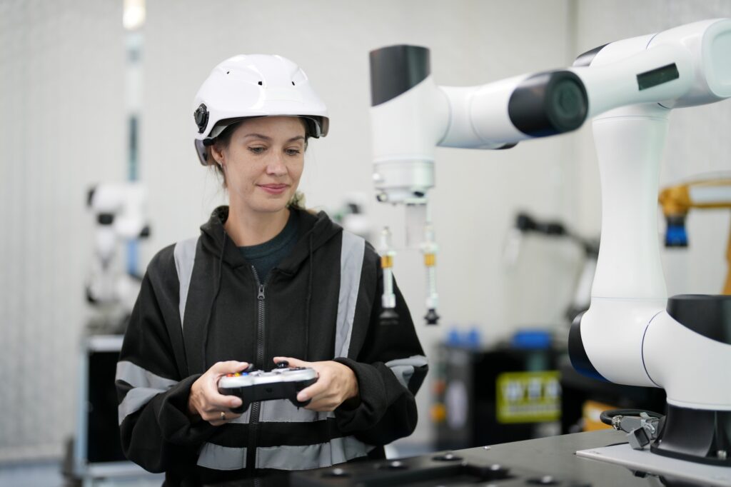 Robotic Arm engineer check on equipment in its with software of an Artificial Intelligence Computer