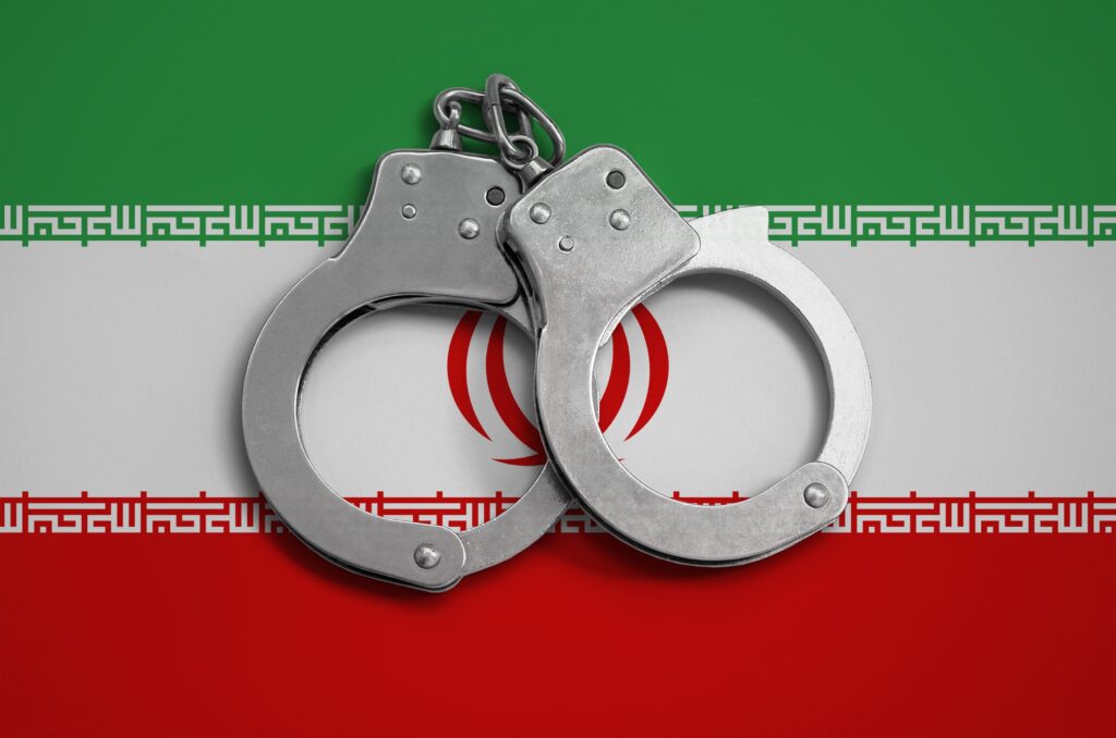 Iran flag and police handcuffs