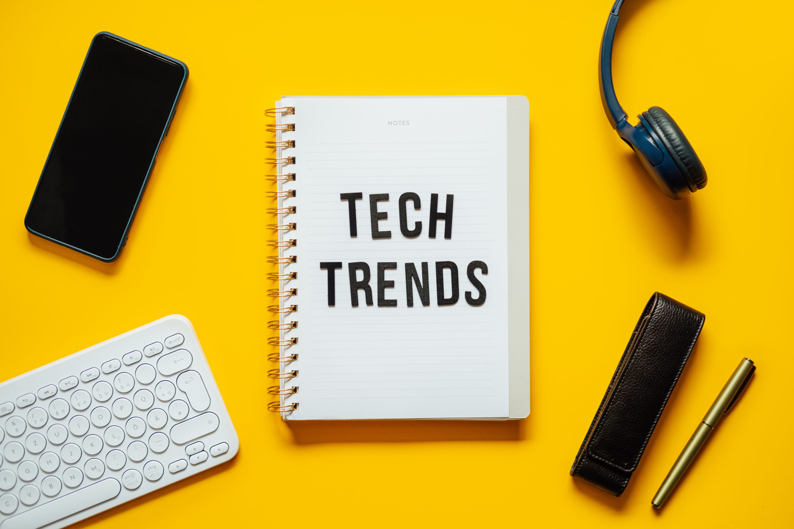 tech trends top new technology trends word trends on open notepad with different gadgets and