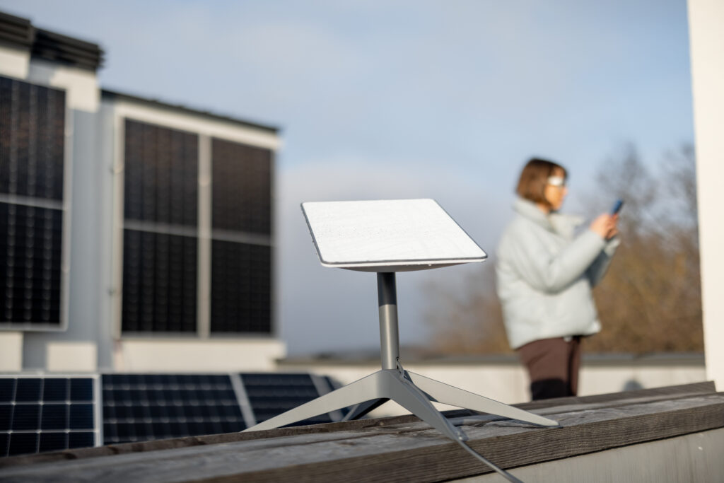 Woman uses Starlink Internet on roof with solar panels