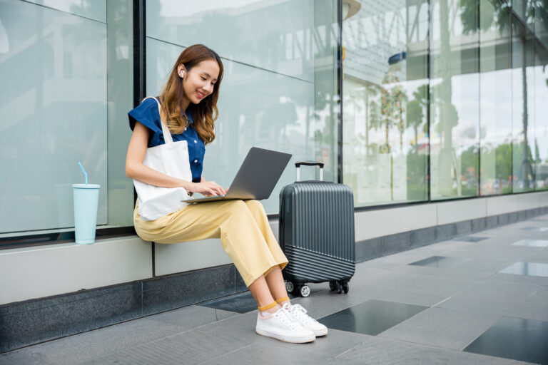 An independent businesswoman types away on her laptop