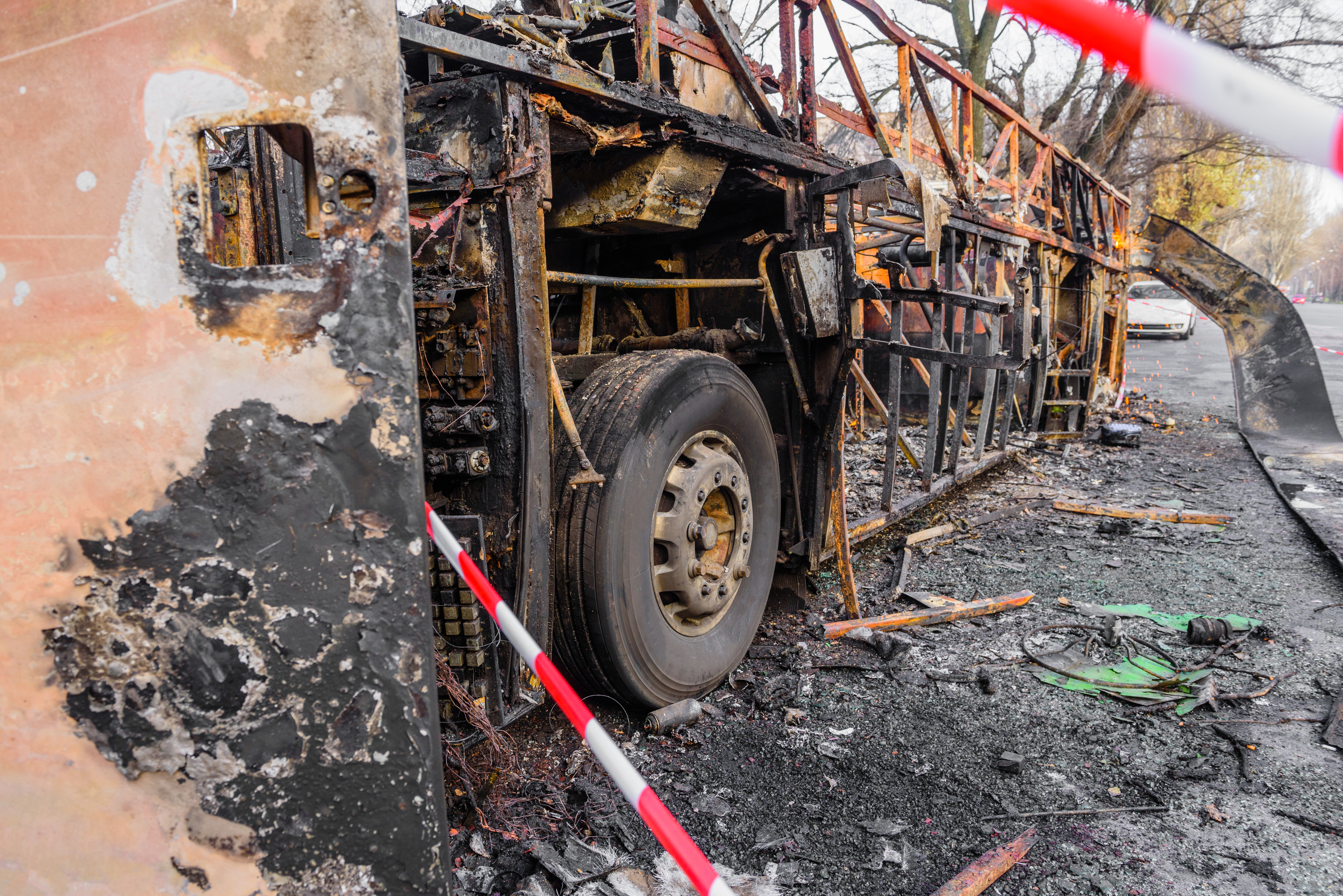 Burnt bus is seen on the street after caught in fire during travel, after fire