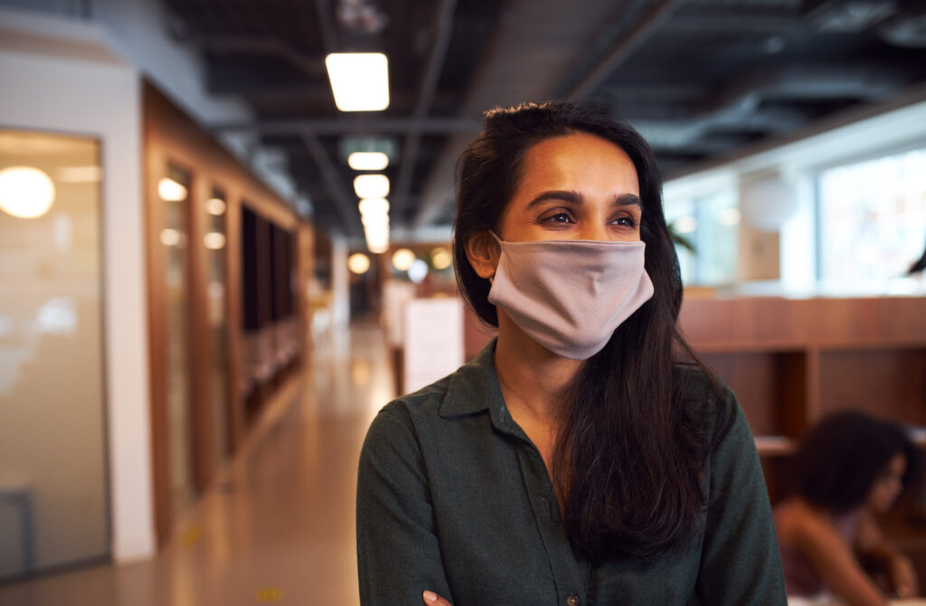 Portrait of Indian businesswoman wearing face mask in office