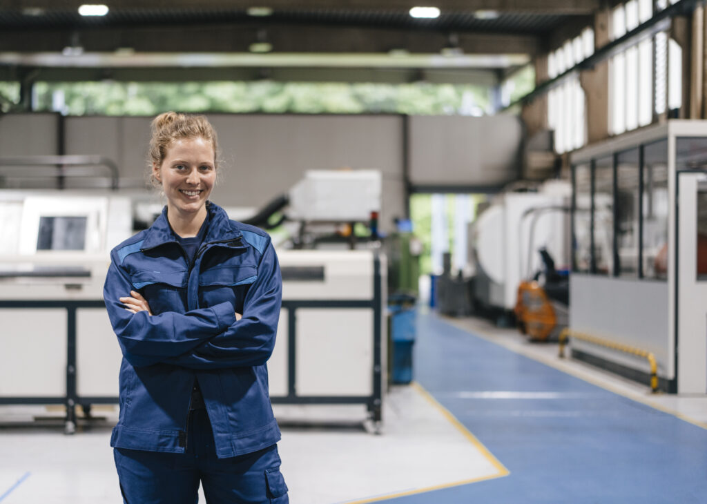 Young woman working as a skilled worker in a high tech company, portrait