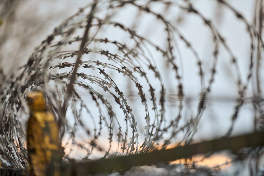 Barbed wire on fence of restricted area