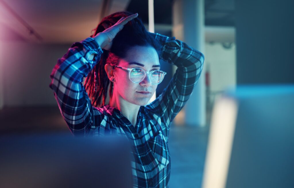 Cybersecurity, password and woman hacker working on a computer in the basement at night for phishin