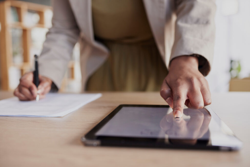 Hand, tablet and fingerprint with a business woman in her office to access a secure database of inf