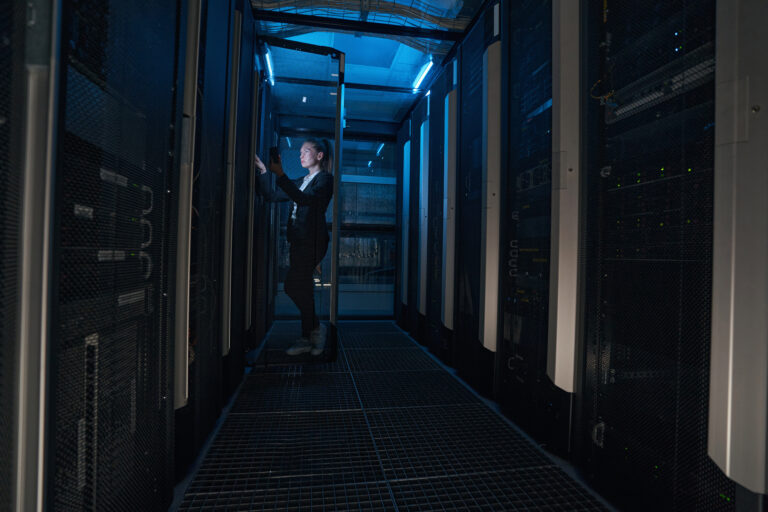 IT engineer checking servers in data center