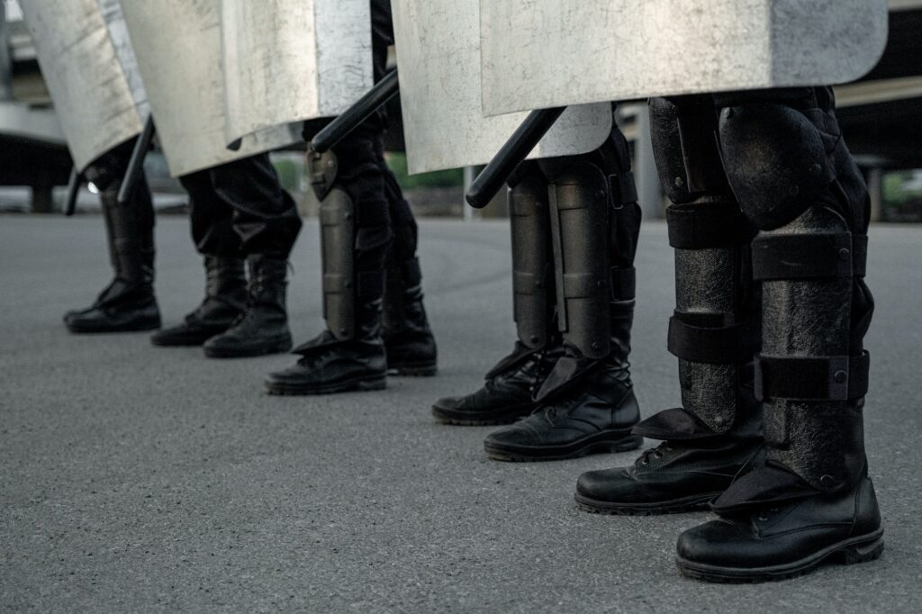 Legs of riot police at street