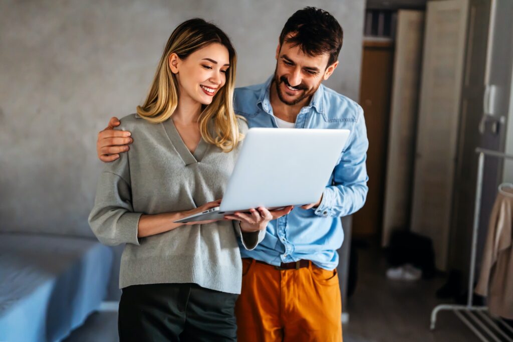 Portrait of success business people working together in home office. Couple teamwork startup concept