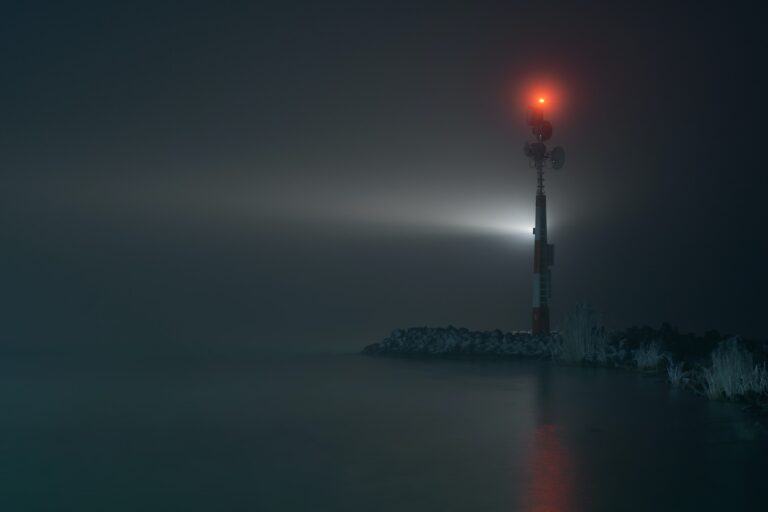 Small lighthouse in the lake at night