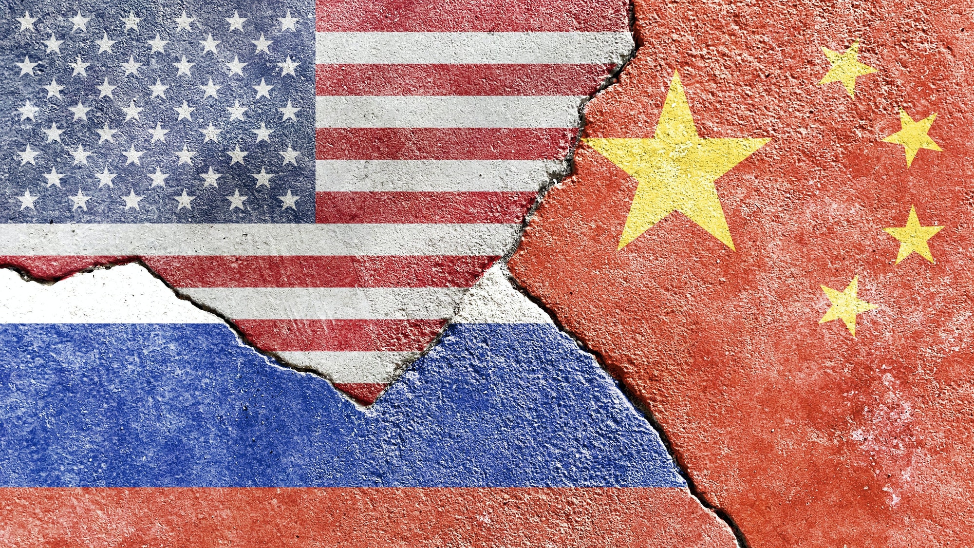 american chinese and russian flag on a cracked wall politics conflict war concept