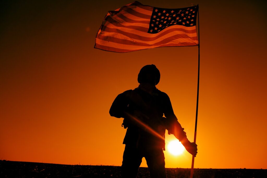 American soldiers with national flag silhouette