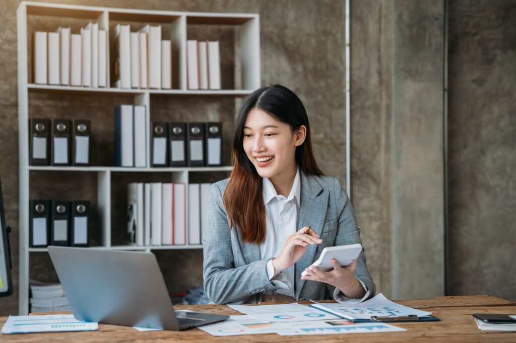 Analysts discuss business with a calculator as a tool.