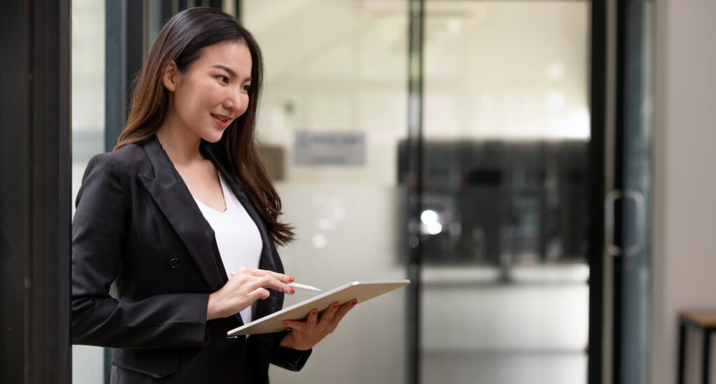 close up asian woman holding tablet pad with smart pen devices with copyspace.