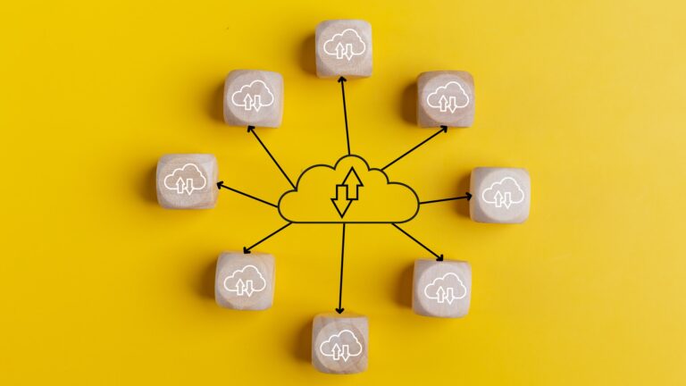 Cloud computing concept with wooden cubes on a yellow background. Top view. Cloud technology.