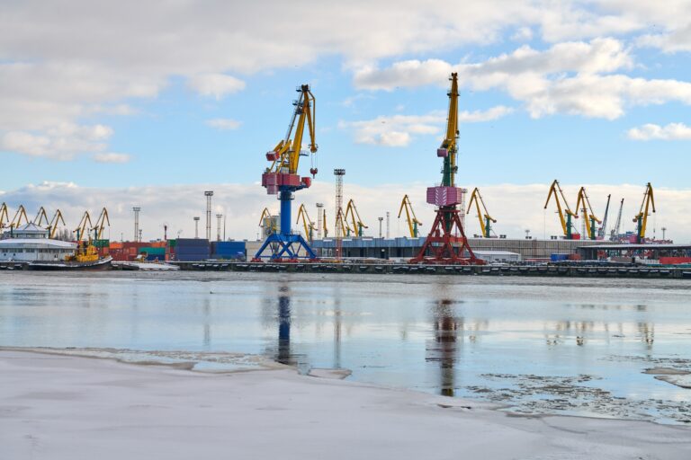 Moored ships and harbor cranes in port