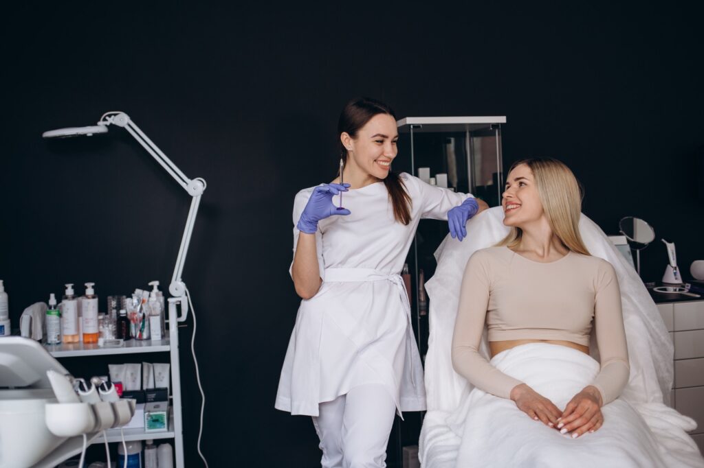 portrait of a beautician and a patient. Wrinkle injection