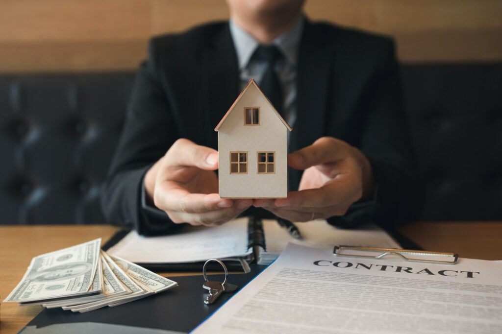 Real estate sales staff give the artificial home to customers.