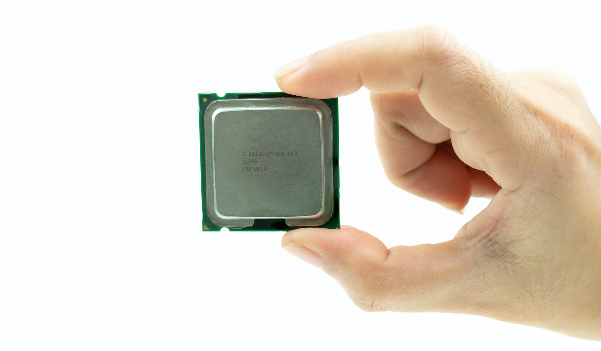 Realistic cpu back view processor chip in hand