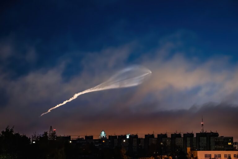 Soyuz space rocket launch. Space jellyfish in sky. Plume of rocket gases in sun at dawn.