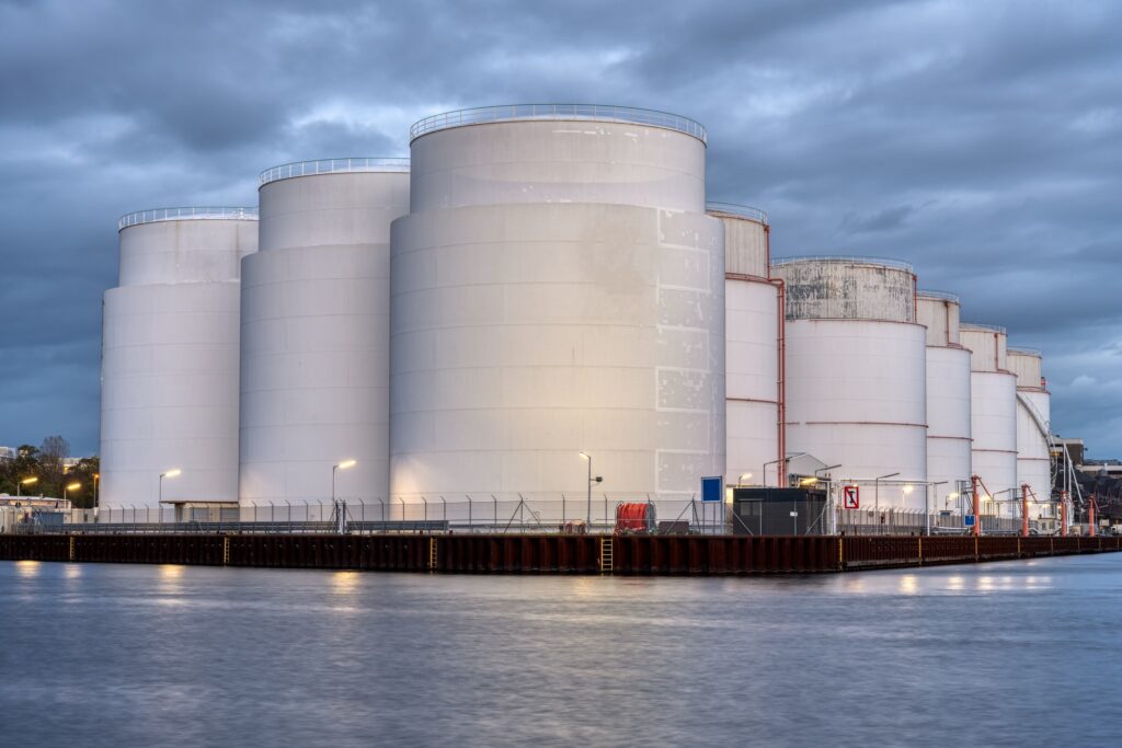 Storage tanks for fossil fuels at dusk