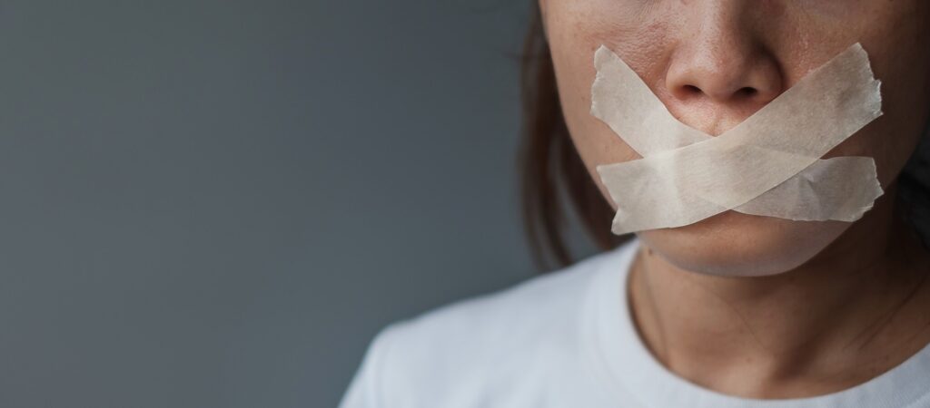 woman mouth sealed in adhesive tape. Free of speech, freedom of press, Human rights