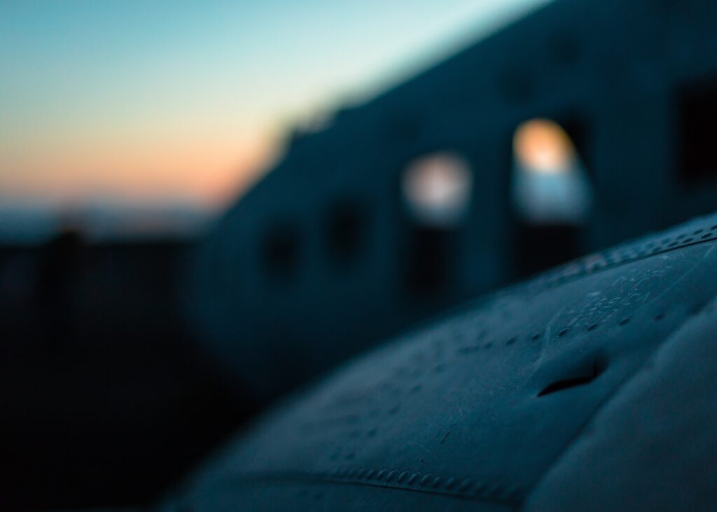 A closeup focused shot of a wing of a crashed airplane