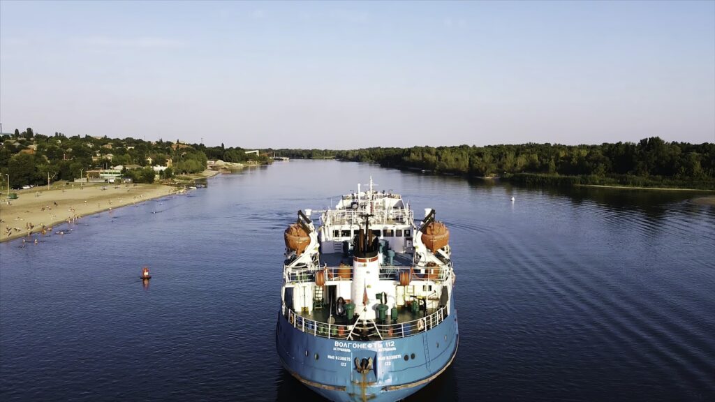 Cargo ship standing at beach. Footage. Top view of beautiful old <a href=