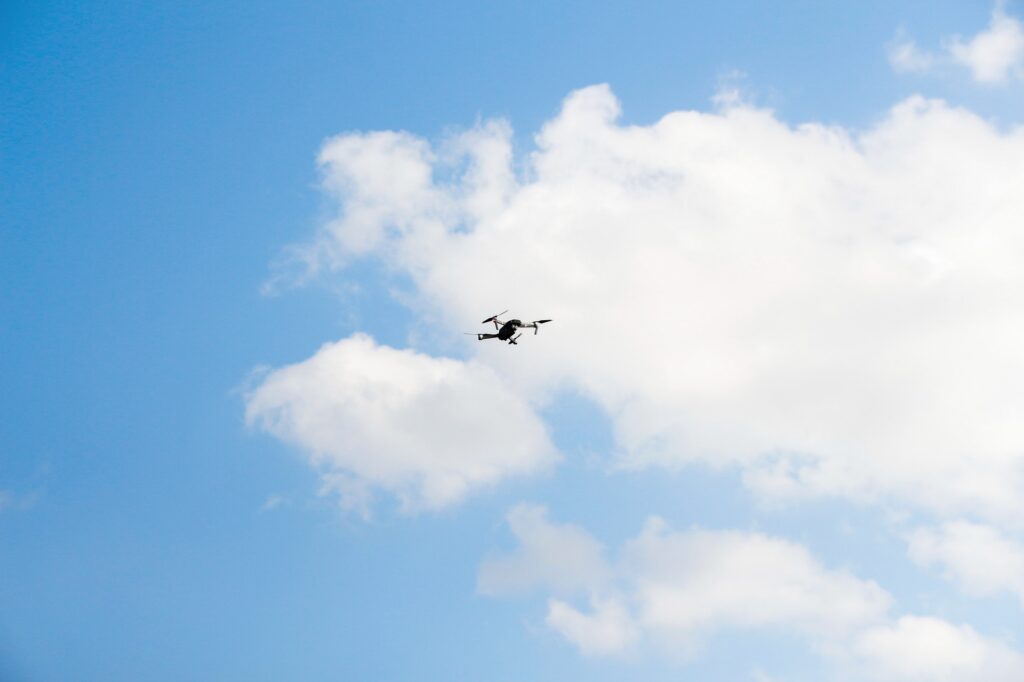 Defocus war drone. Drone flying in a blue sky. The black army un