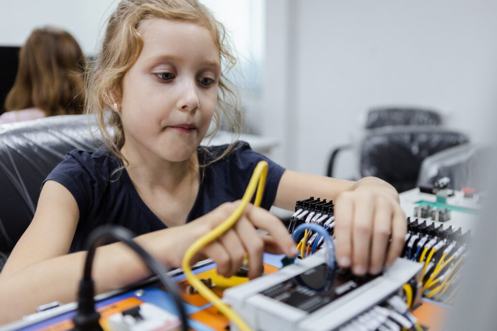 Happy girl education electronic on table at class room. learning innovation electronic for future AI