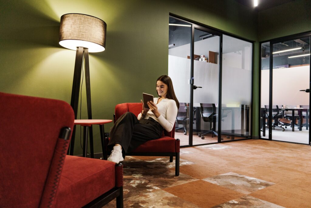 manager works in a coworking space in office clothes. Portrait of a woman smiling emotion