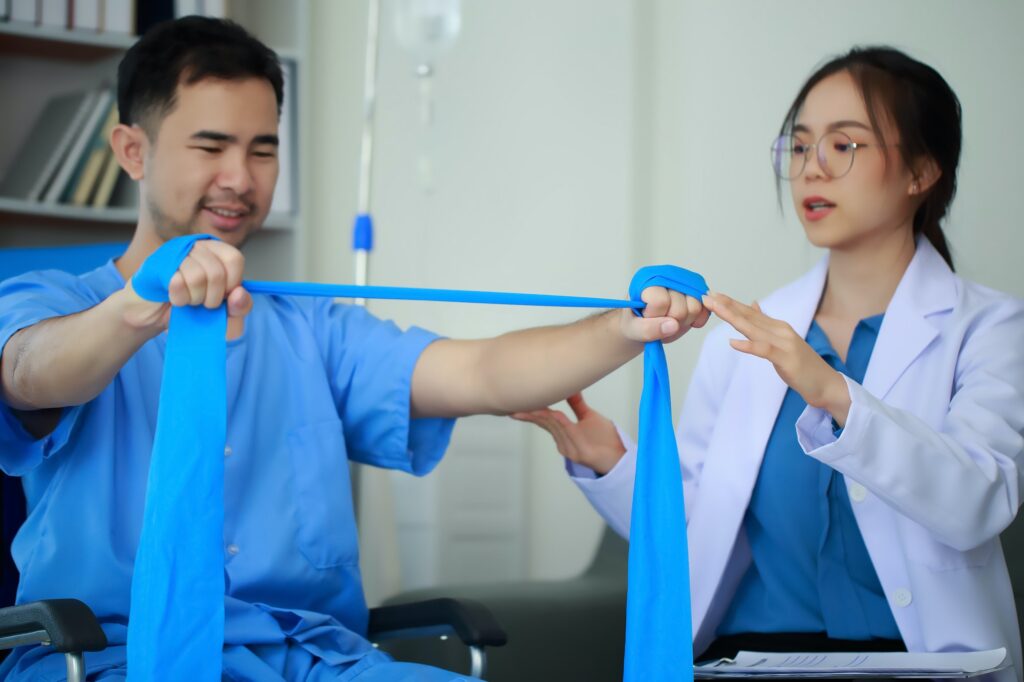 Physical therapist helping a patient in physical therapy poses, The patient cooperates well with the