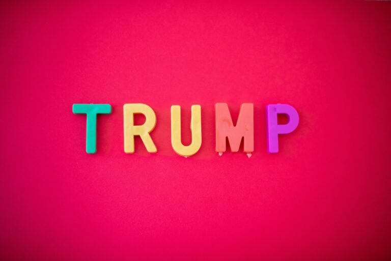 The word TRUMP isolated against red background shot from directly above