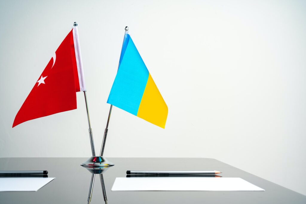 Turkey and Ukraine flags on table close up