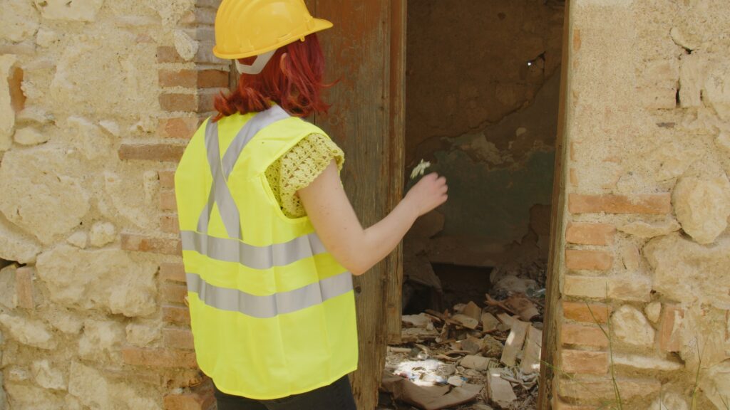 Young girl engineer checks the city after earthquake disaster