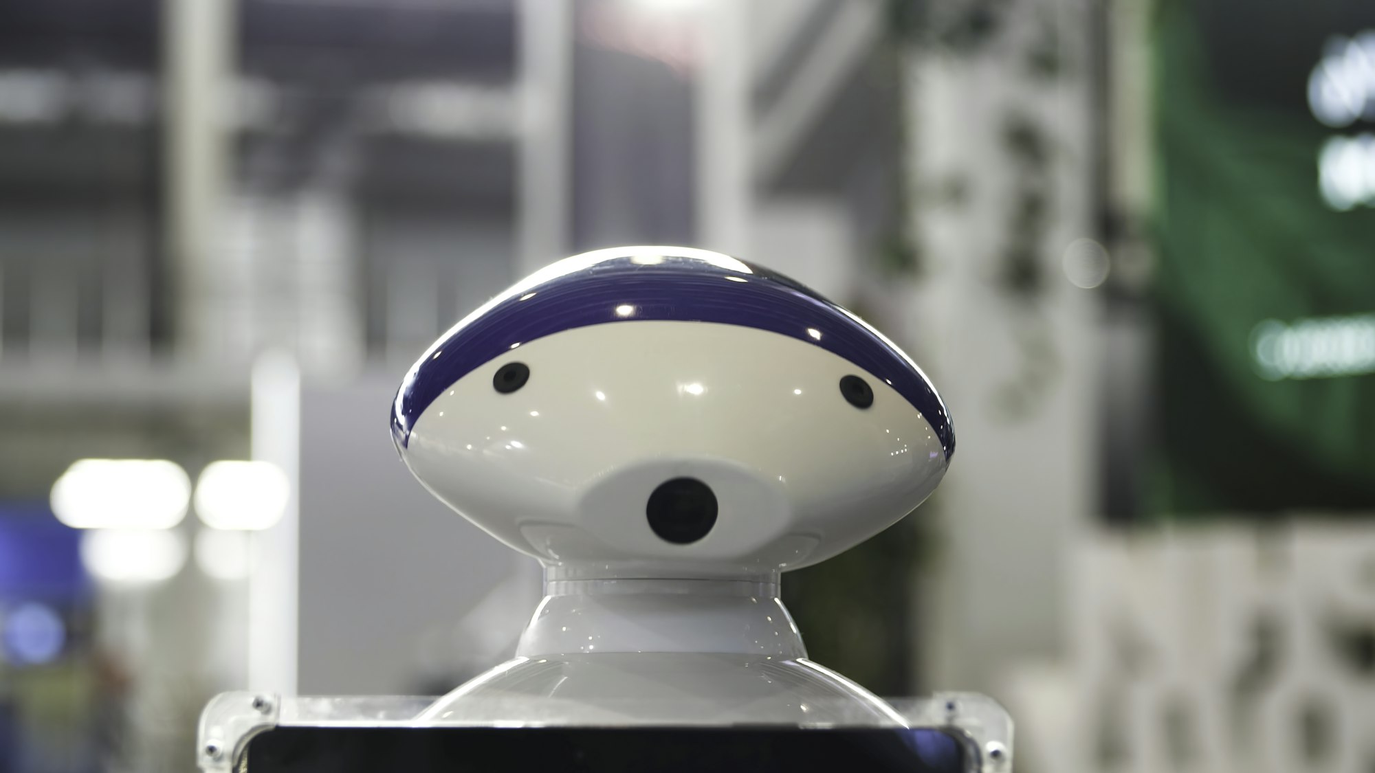 Close up of the moving humanoid robot with a camera on his head. Media. New technological robot