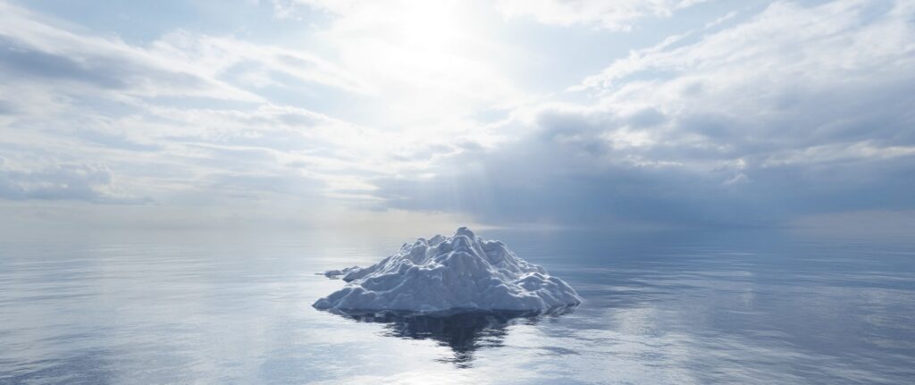 Melting iceberg on the ocean. Global warming and climate change