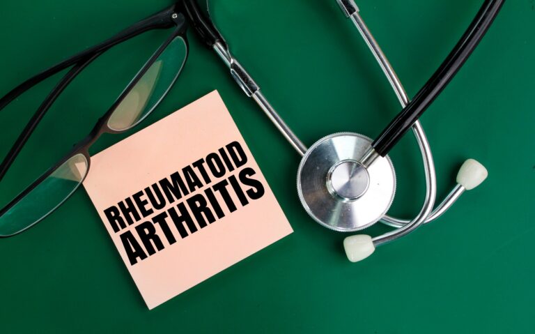 stethoscope and glasses with the word rheumatoid arthritis.