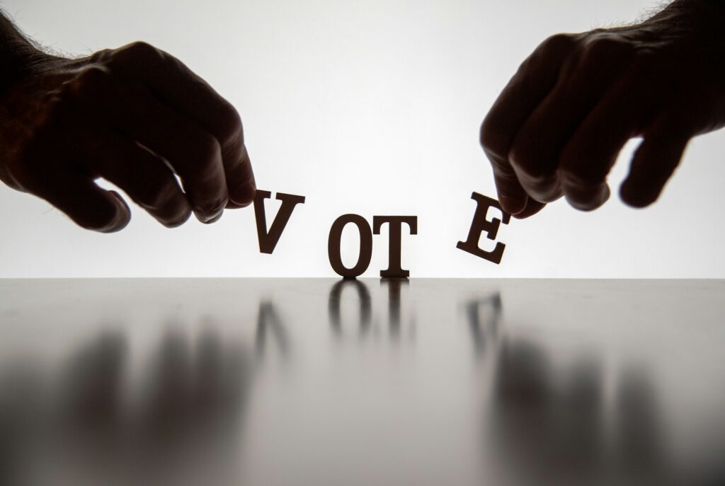 VOTE letters being placed on surface