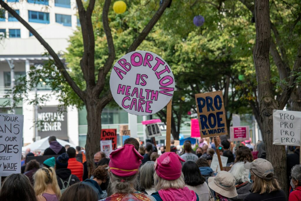 "Abortion is health care" protest sign at rally.