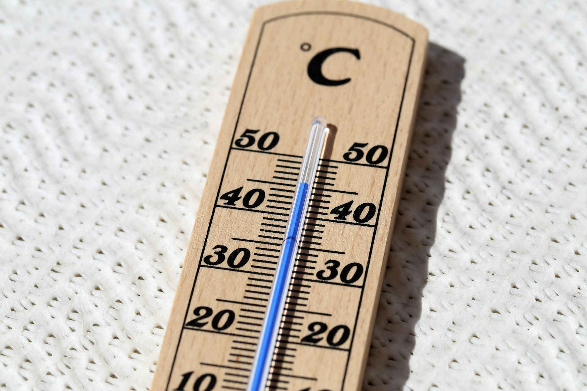 Closeup shot of a thermometer showing a high temperature - concept of global warming