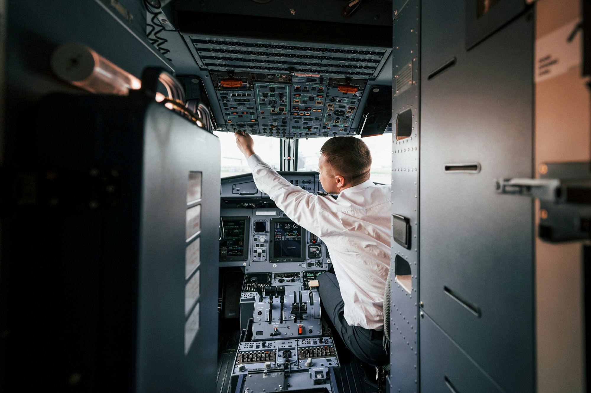 Control of the flight. Pilot on the work in the passenger airplane. Preparing for takeoff