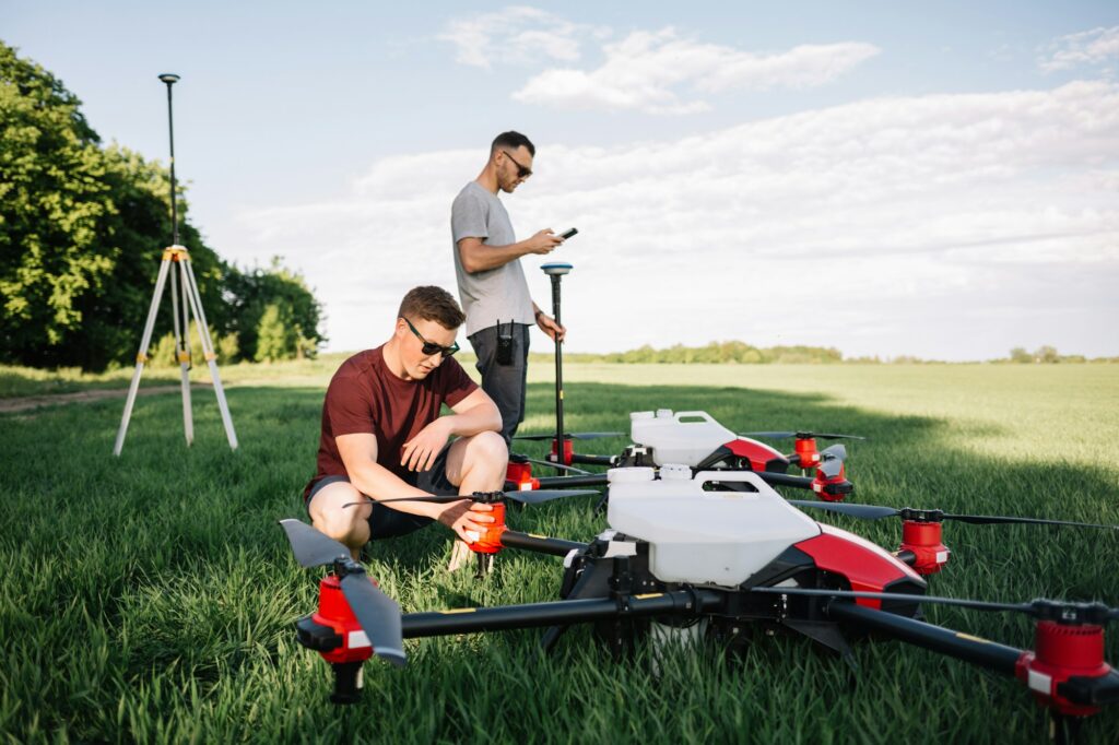 farmers set up agricultural drones before cultivating the fields.